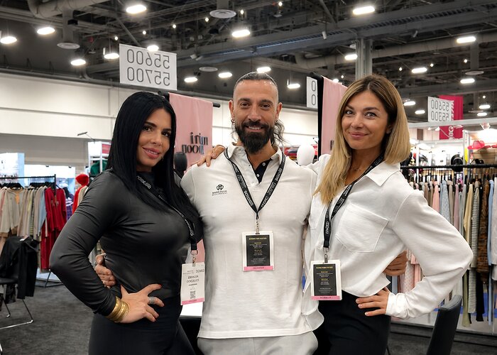 Atlas staff with a client at a fashion trade show